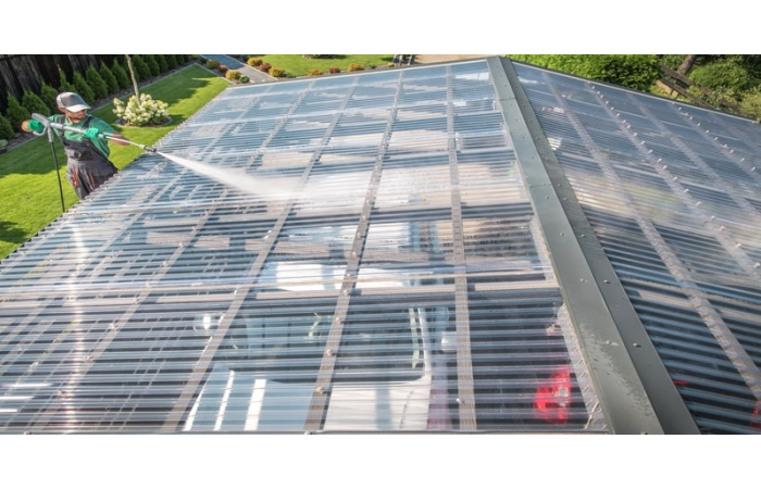PVC corrugated roofing sheet being cleaned
