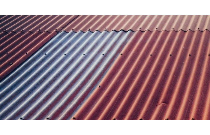 silver and red metal corrugated roof sheets