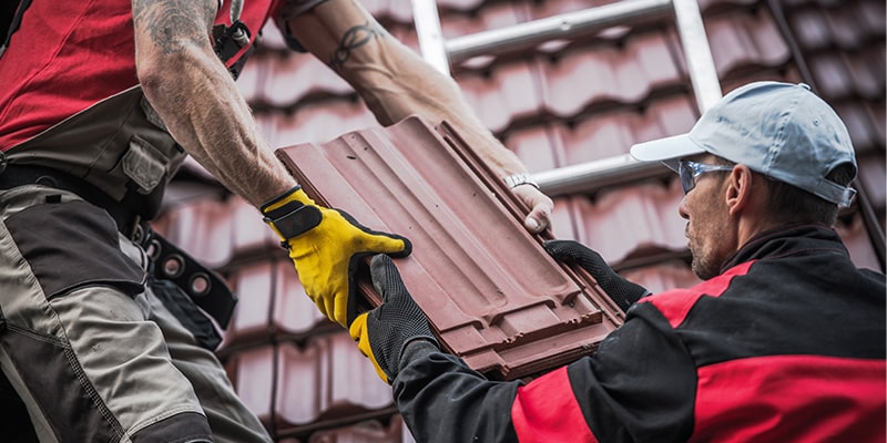 concrete roof tiles being installed