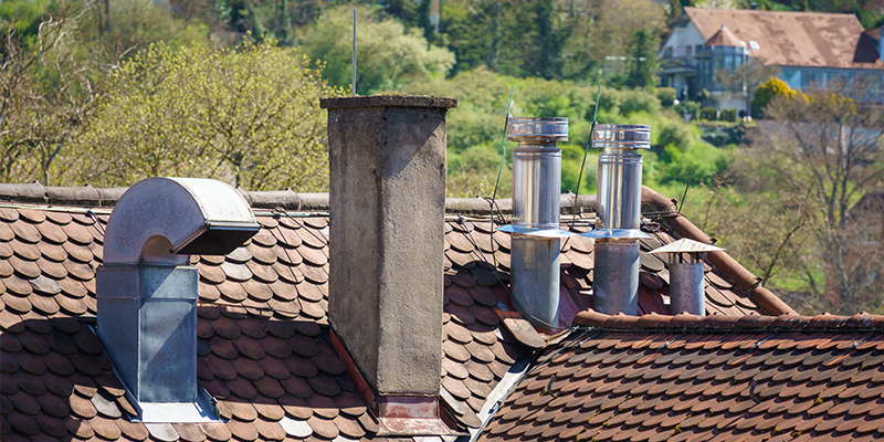 view of chimney rooftops