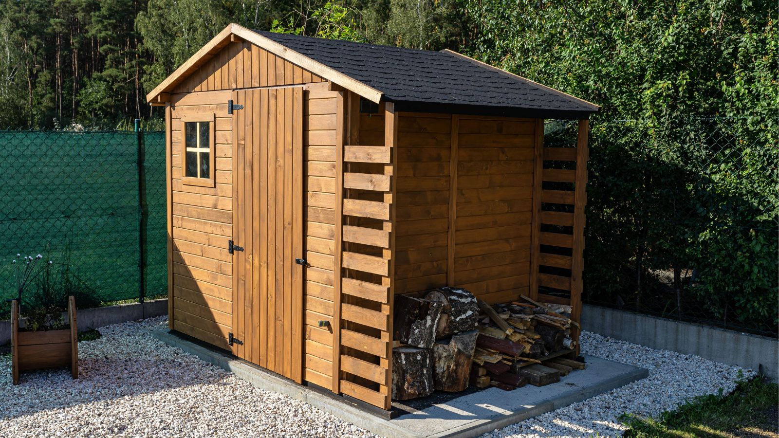 timber shed, black felt shingle roof