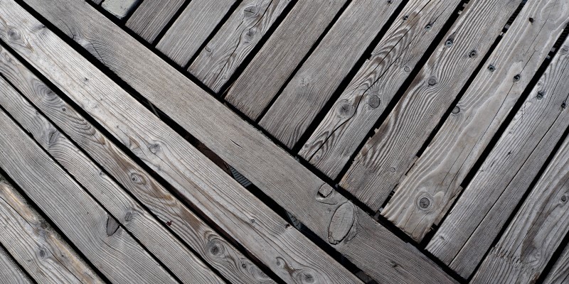 close up of grey timber decking boards