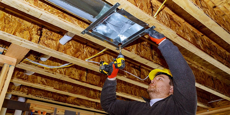 technician installing cooling system