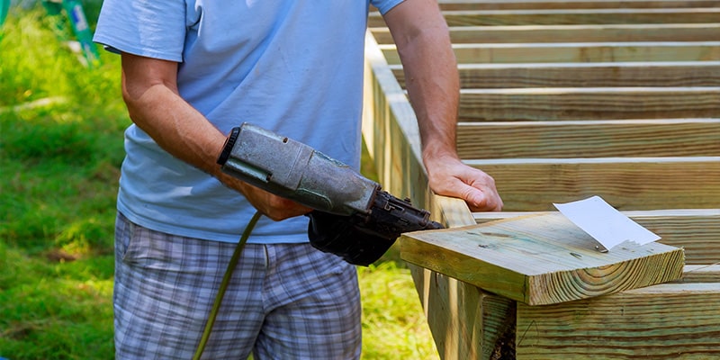 worker installing decking