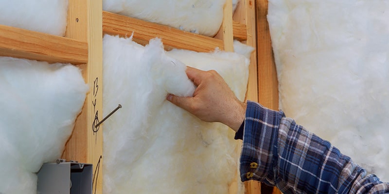 worker insulating house