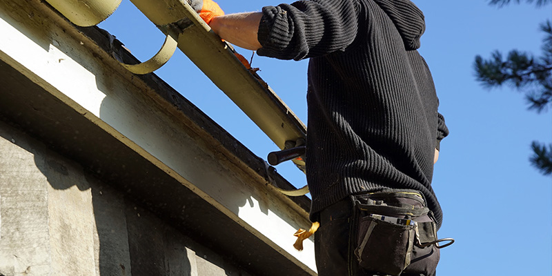 contractor checking gutters