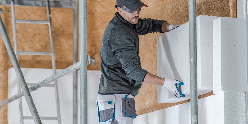 contractor installing insulation