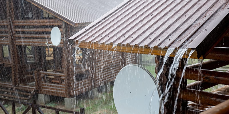 low pitched roof protecting house against heavy rainfall