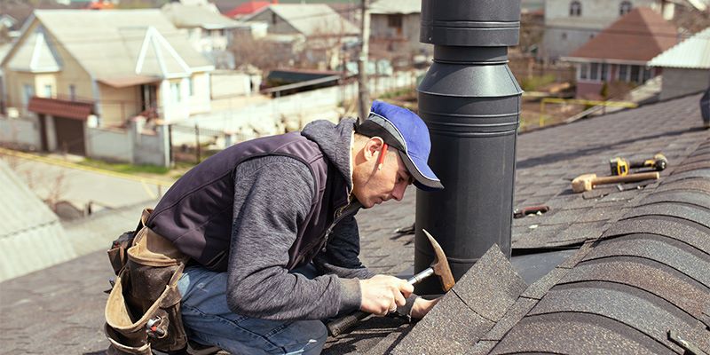 roofer carrying out roof repairs